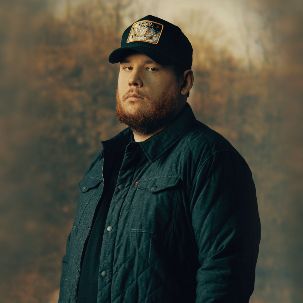 Luke Combs wearing a jacket and cap